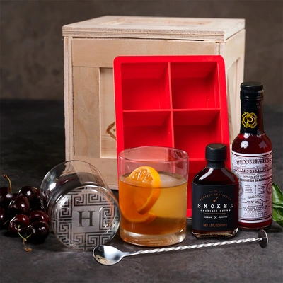 Smokin' Old Fashioned Crate includes smoked maple syrup, old fashioned glasses, ice molds, aromatic bitters, and a recipe book.