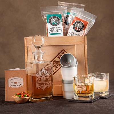 Whiskey Appreciation Crate includes a hand-made glass decanter, whiskey glasses, ice sphere molds, slate coasters, snacks and a drinking journal.