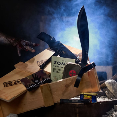 The Zombie Survival Crate includes machete, zombie survival guide, flashlight, first aid kit, duct tape, and SPAM.
