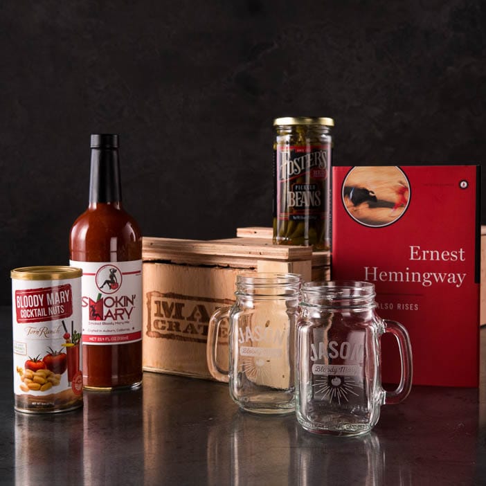 Storied Sunrise Cocktail Crate includes bloody mary mix, cocktail peanuts, pickled green beans, mason jar glasses, and The Sun Also Rises by Ernest Hemingway .