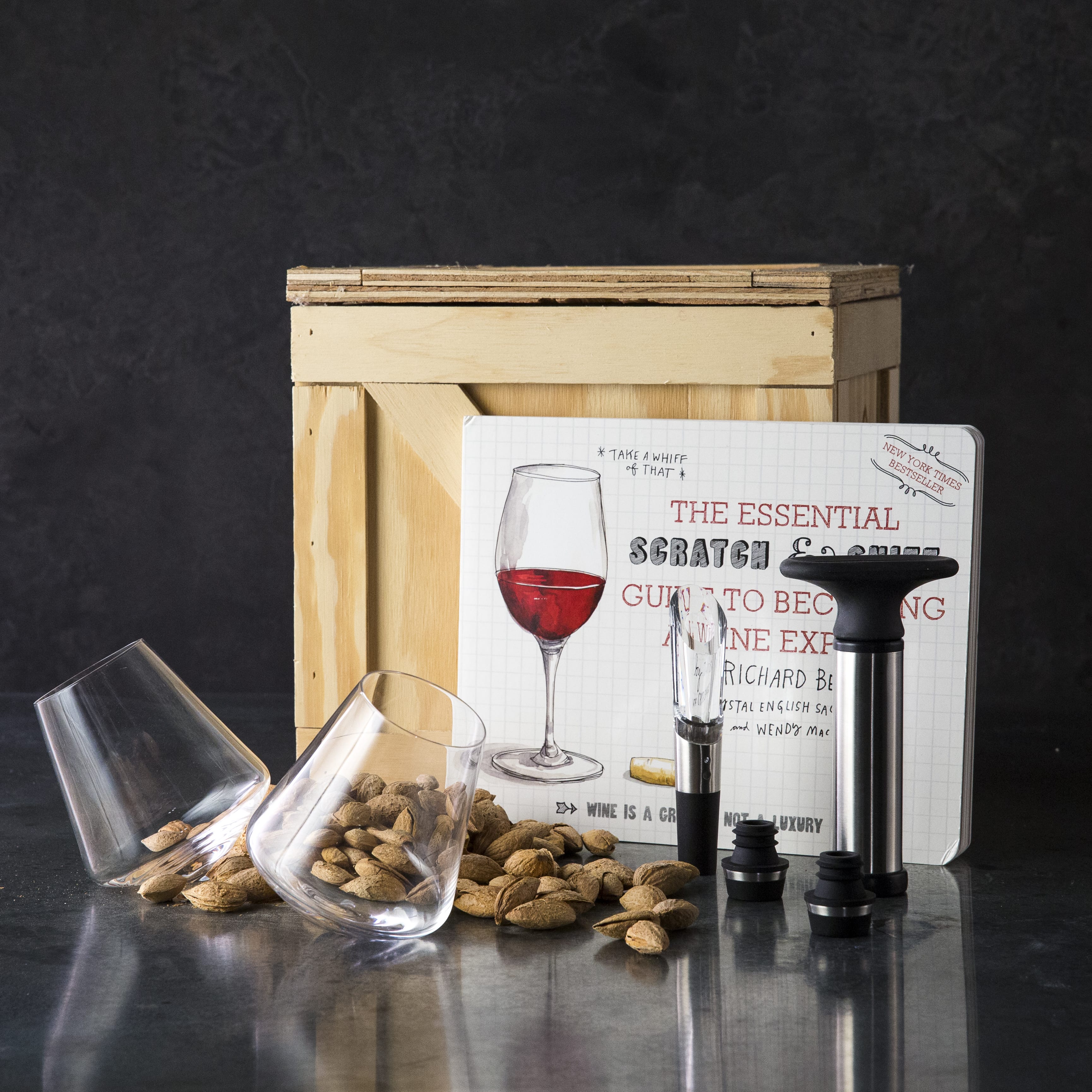 Wine Snob Starter Kit includes wine glasses, a fun wine book, aerator, wine preserver, and almonds.