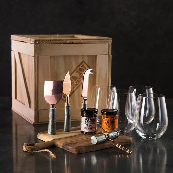Wine Connoisseur Crate includes a cheese knife set, wine opener, cheese board, stemless wine glasses, jelly and jam for cheese pairings.