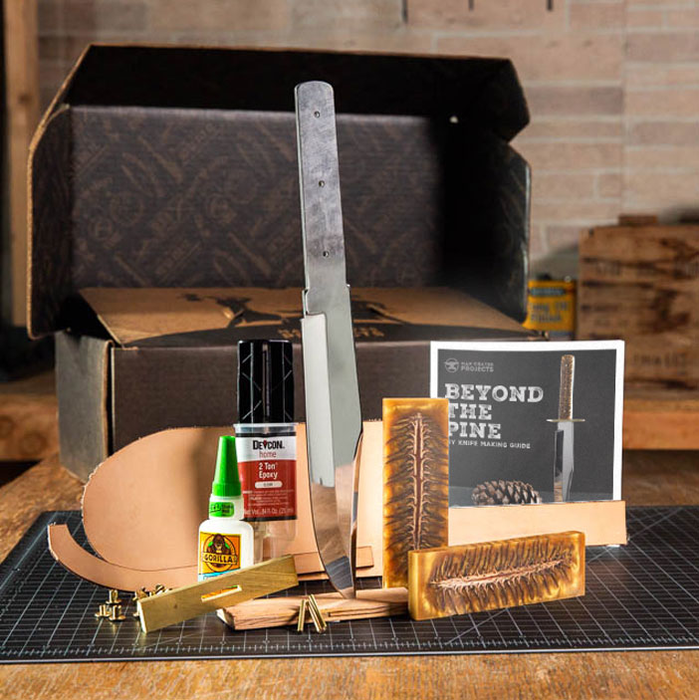 Knife blade, pinecone blocks, glue, epoxy, and box for a great men's DIY gift.