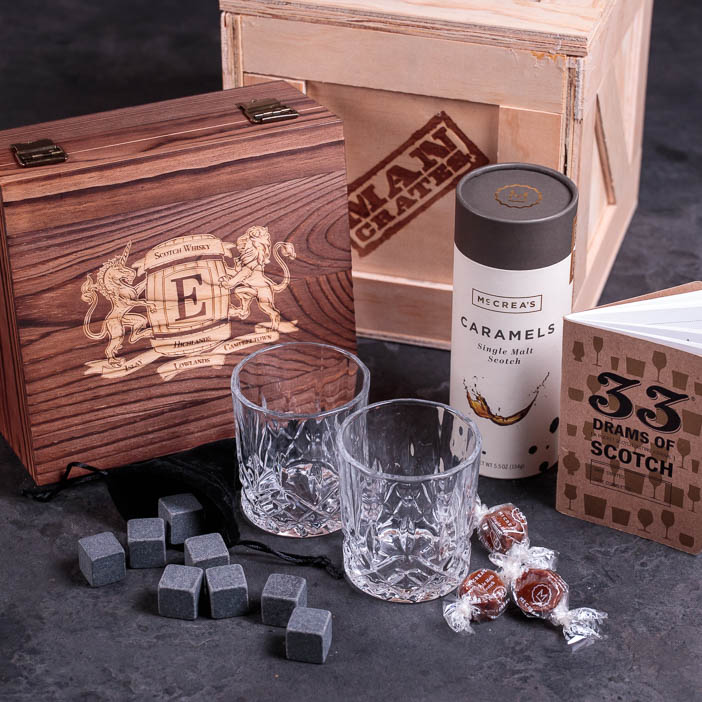 Scotch glasses, stones, journal, and caramels with crate are a great men's drink gift.