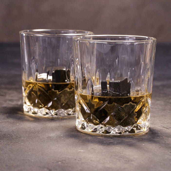 Whisky Glasses with two fingers of Scotch are a great men's drink gift.