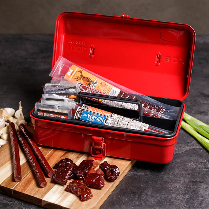 Exotic Jerky packed neatly in a red Tool Box for a great men's gift.