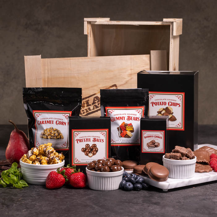 Front view of Chocolate covered potato chips, nuts, popcorn, and cookies is a great men's snack gift.
