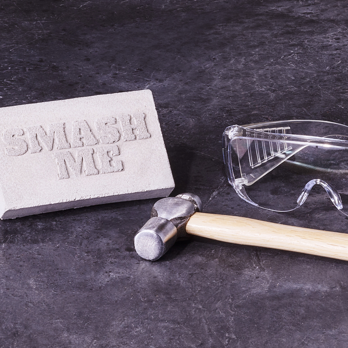 Smash & Grab Gift Card includes a gift card encased in concrete, hammer, and safety goggles.
