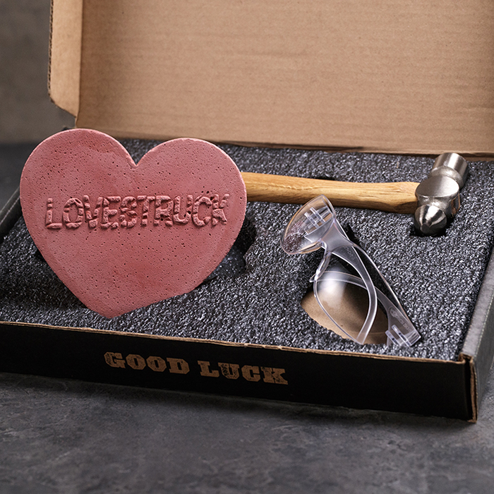 Heart shaped brick, hammer, and safety glasses for men's gift.