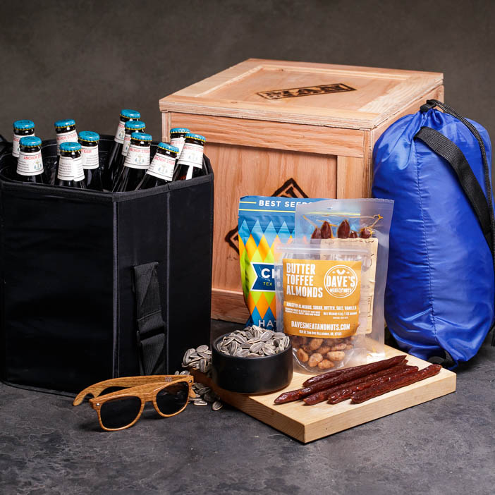 Sunglasses, jerky, snacks, beer tote, inflatable, and crate for a great men's interest gift.