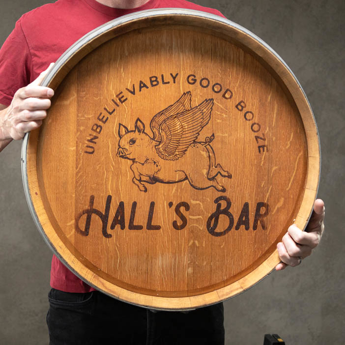 Man holding Personalized Barrel Sign is a great men's personalization gift.
