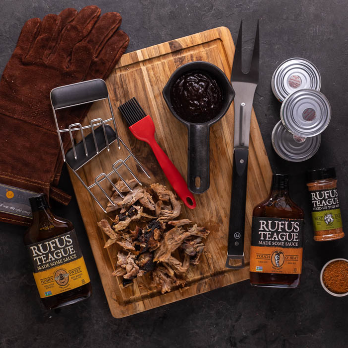 Pit Master Crate overhead view of tools and sauces grilling gifts.
