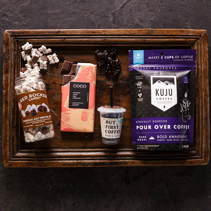 Coffee beans, snacks, and chocolates overhead view is a great men's snack gift.