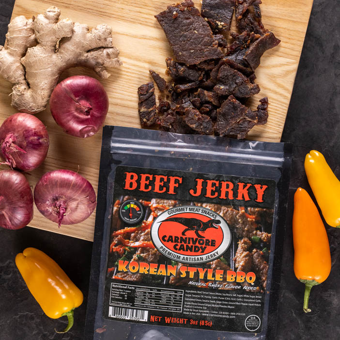 Korean style BBQ jerky being spilled on a cutting board is a great men's snack gift.