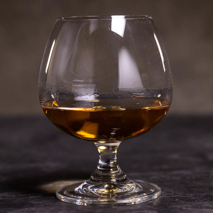 "Snifter" glass with whiskey for a great men's whiskey gift.