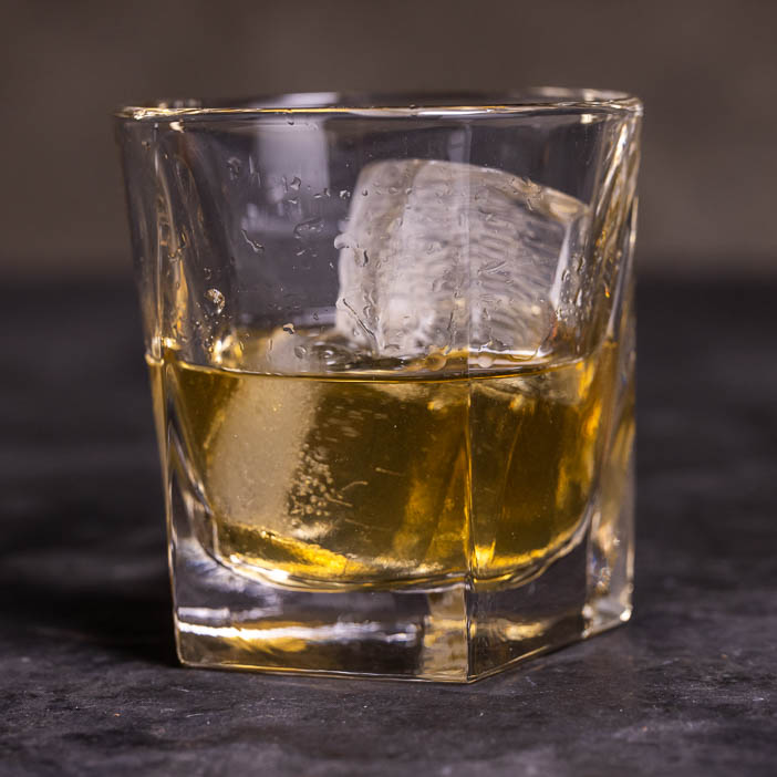 "Rocks" glass with whiskey for a great men's whiskey gift.