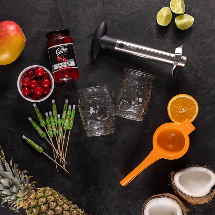 The Tropical Tiki Cocktail Crate has all the gear to make classic vacation cocktails on his very own kitchen island.