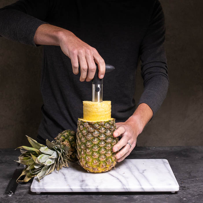 Tack on the tropical flavors of an island vacation with all the supplies he’ll need to whip up tasty, Tiki cocktails at home, like a pineapple corer!